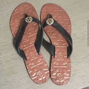 Authentic Tory Burch flip flops with metal logo